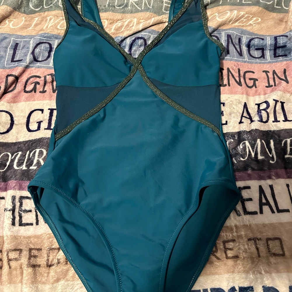 Turquoise one piece bathing suit.